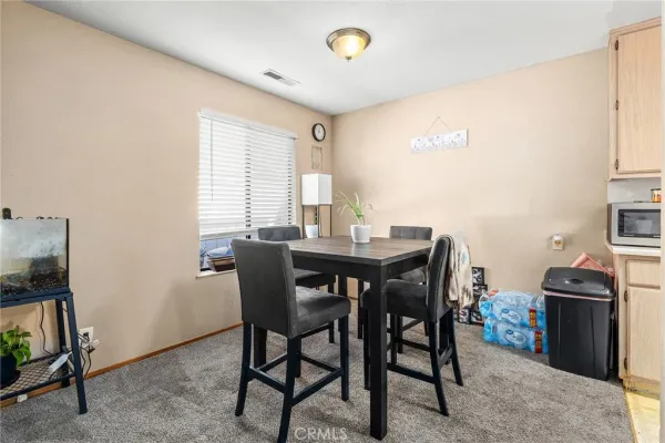 a view of a dining room with furniture
