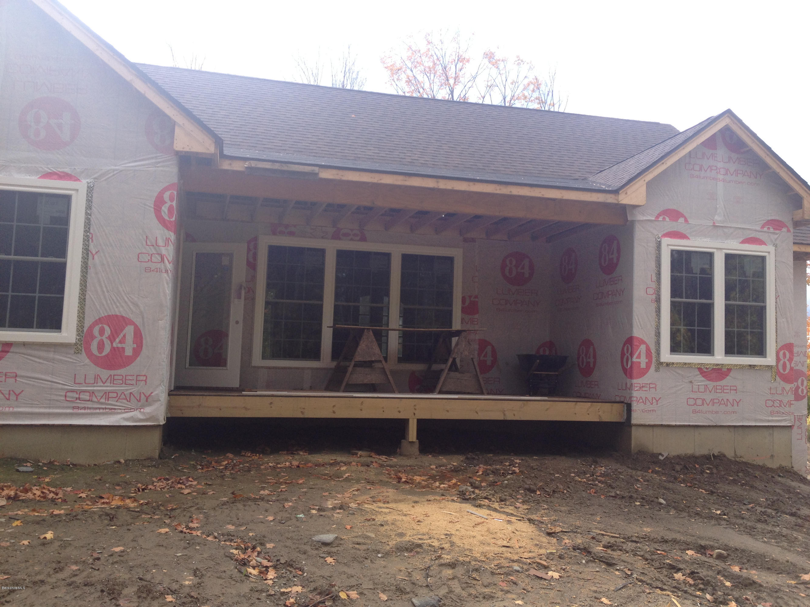 600 Devon Road Lee, MA 01238 - Photo 5 of 15 a view of brick house with large windows