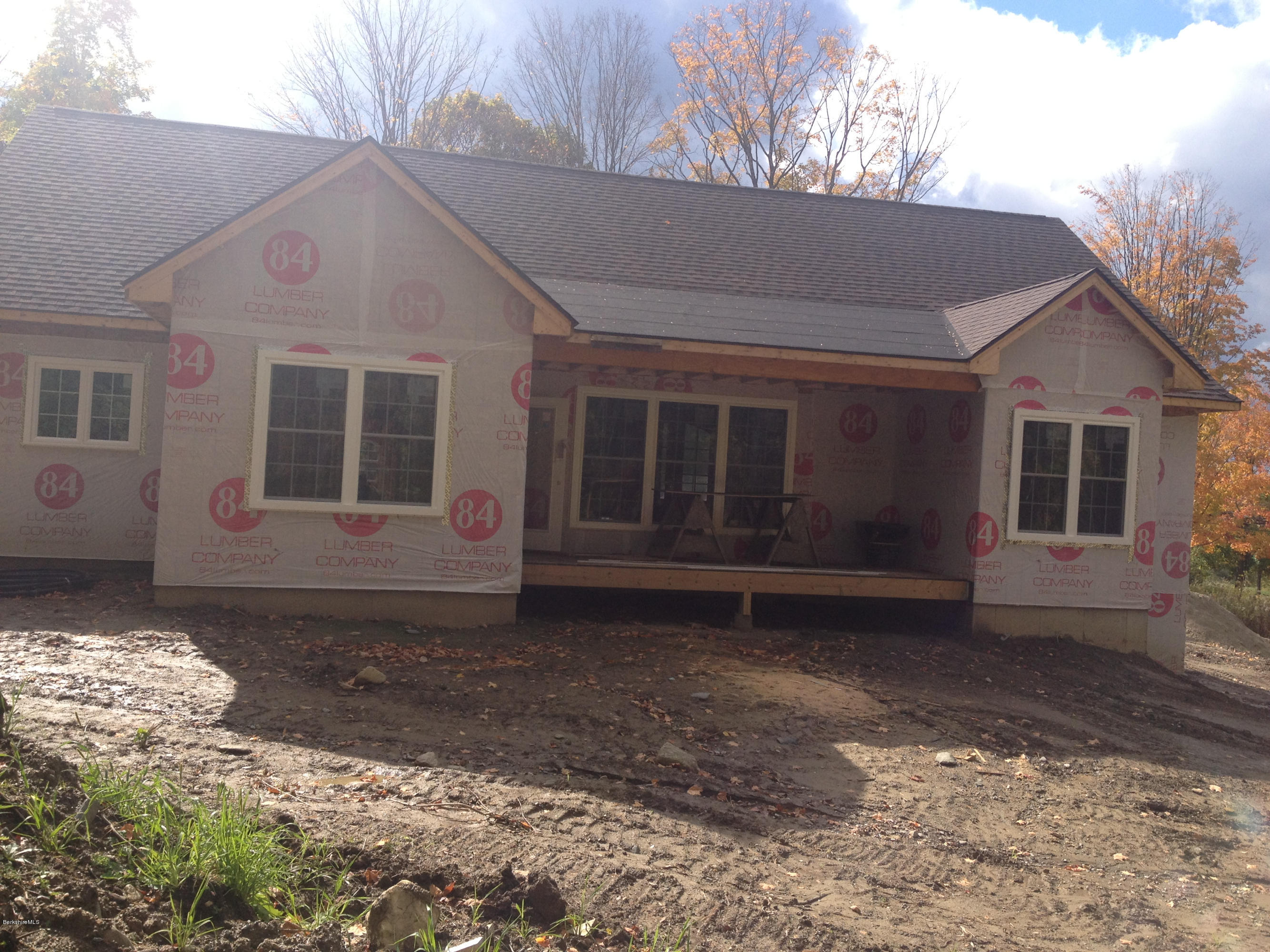 600 Devon Road Lee, MA 01238 - Photo 9 of 15 a front view of a house with a yard