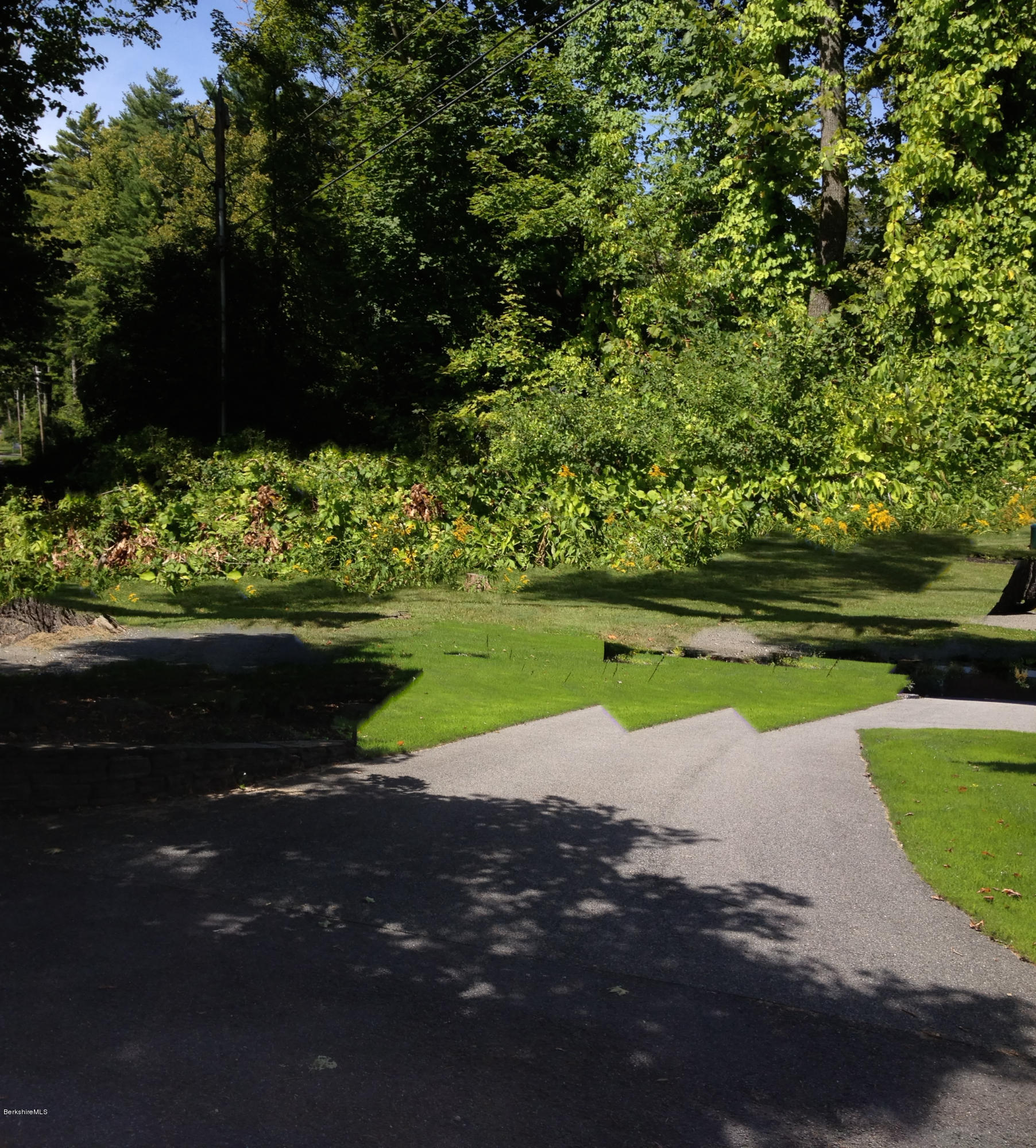600 Devon Road Lee, MA 01238 - Photo 10 of 15 a view of a lake with a big yard