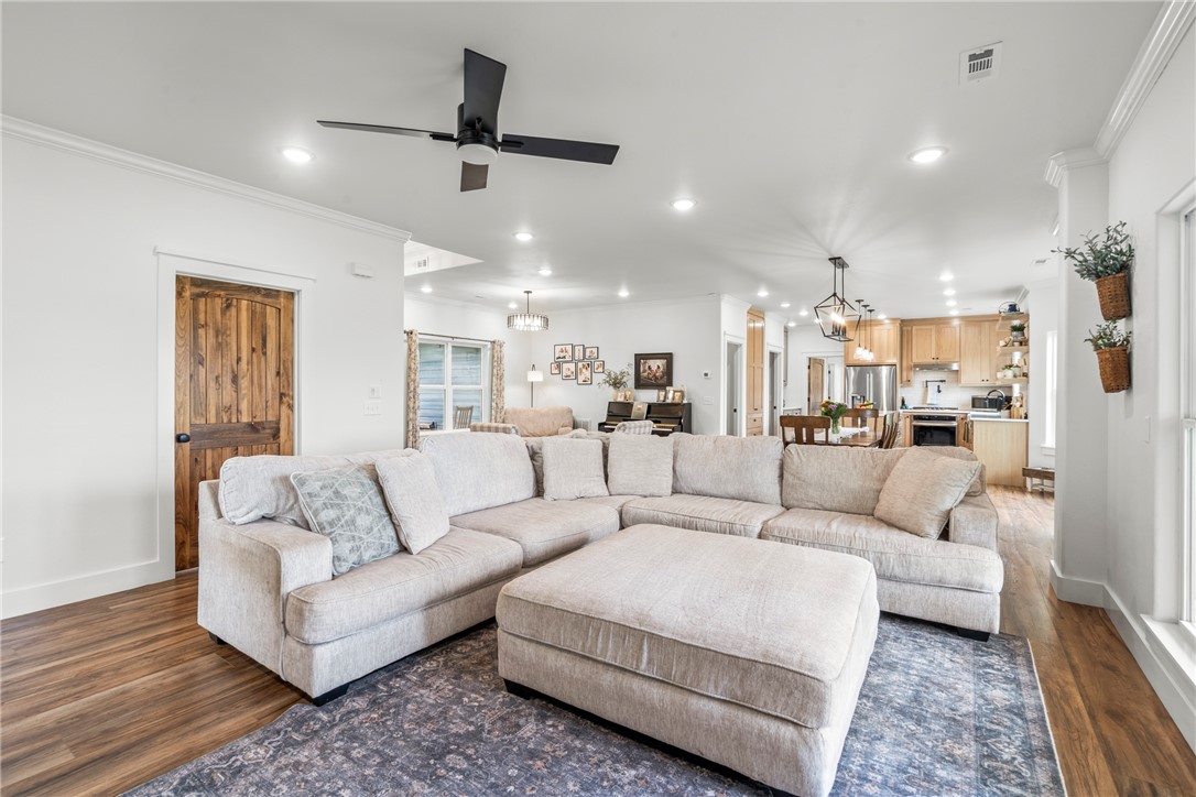 16556 East Hewitt Springs Road Springdale, AR 72764 - Photo 17 of 60 Open-concept living area featuring wood-finish flooring, recessed lighting, and a modern ceiling fan