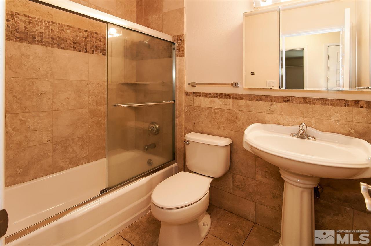 4510 Azalea Drive Reno, NV 89502 - Photo 8 of 16 a bathroom with a sink a toilet and shower