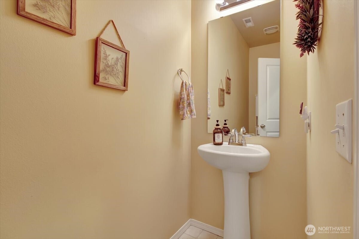 5488 Buckhorn Way Mount Vernon, WA 98273 - Photo 17 of 40 a bathroom with a sink and mirror