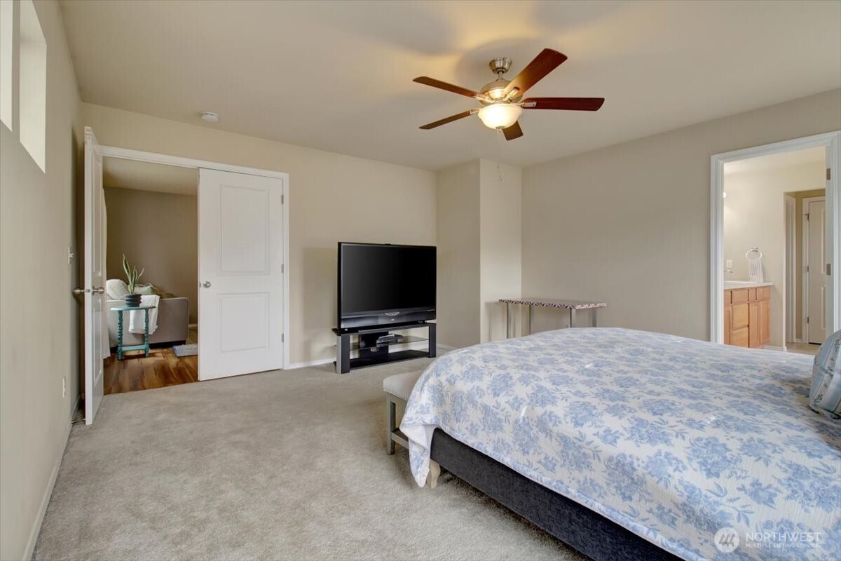 5488 Buckhorn Way Mount Vernon, WA 98273 - Photo 24 of 40 a bedroom with a bed and a flat screen tv