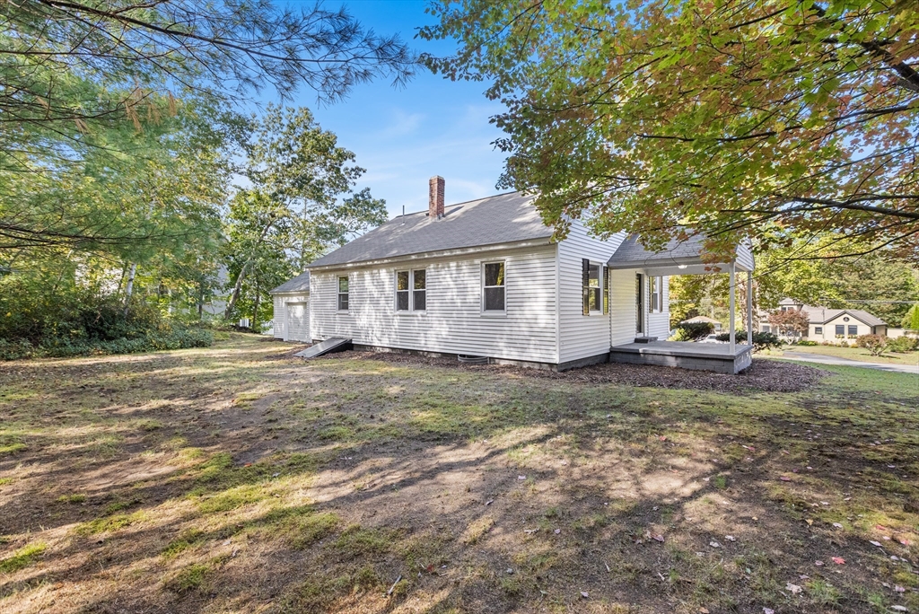 222 Forge Village Road Groton, MA 01450 - Photo 12 of 12 a view of a house with a yard