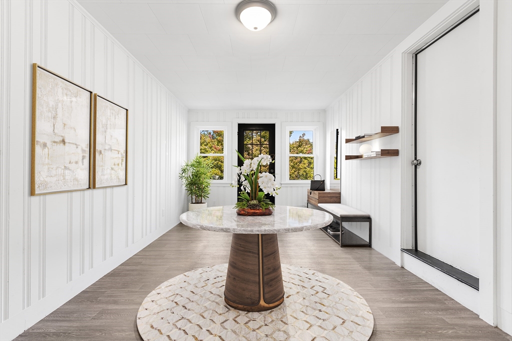 222 Forge Village Road Groton, MA 01450 - Photo 5 of 12 a living room with furniture and a potted plant