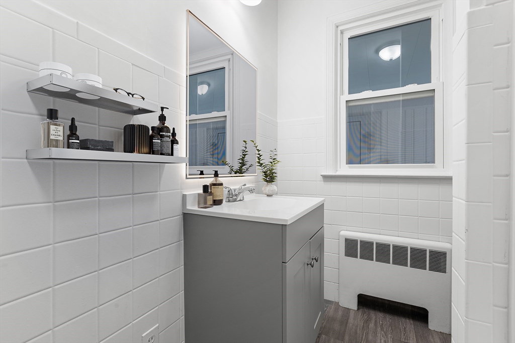 222 Forge Village Road Groton, MA 01450 - Photo 7 of 12 a bathroom with a sink and a mirror