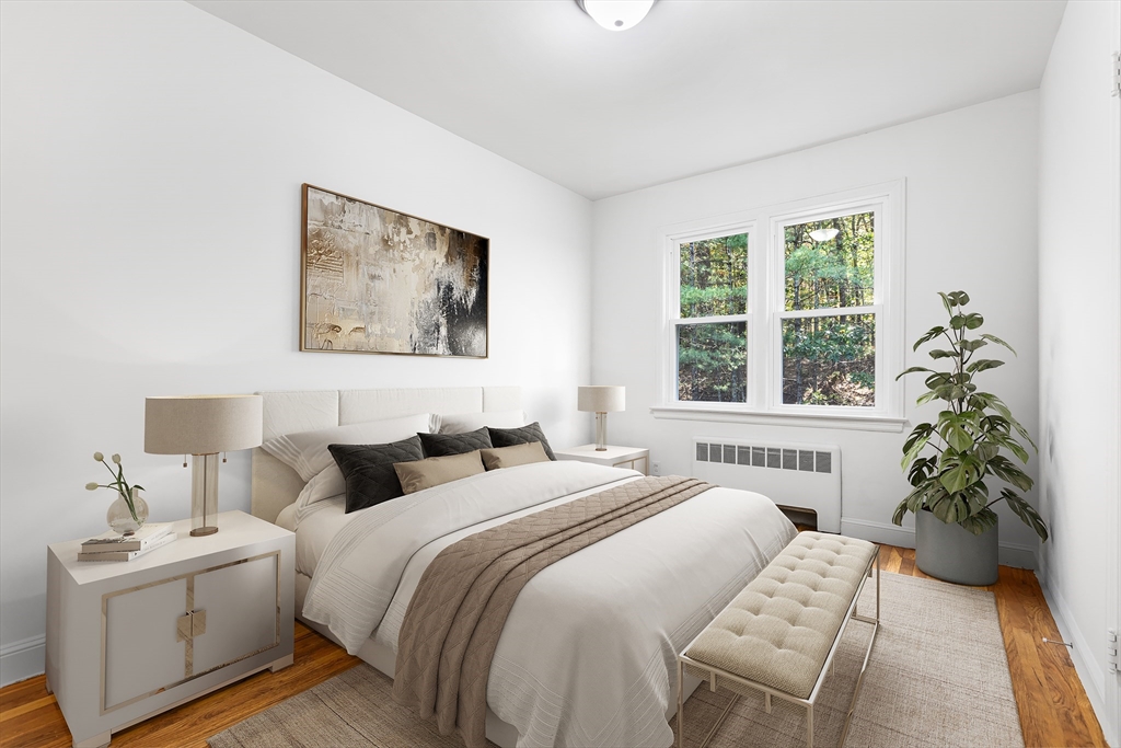 222 Forge Village Road Groton, MA 01450 - Photo 8 of 12 a bedroom with a bed and a window