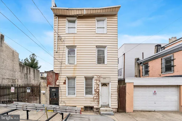 a front view of a house with a garage
