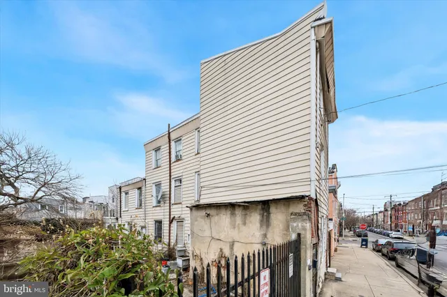 a view of a street with a house