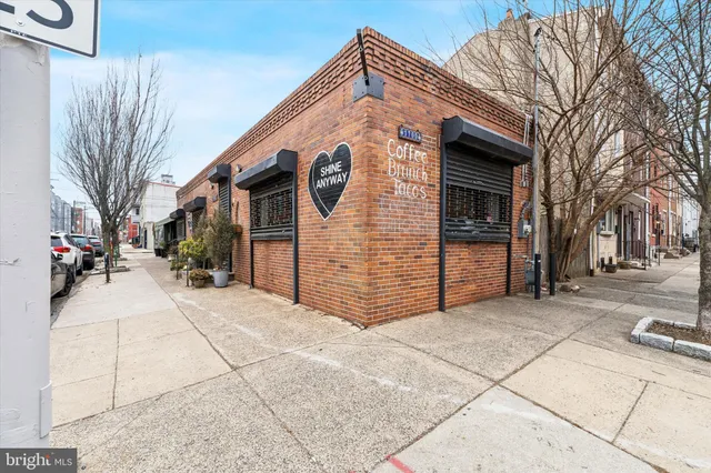 a view of a house with a snow on the road