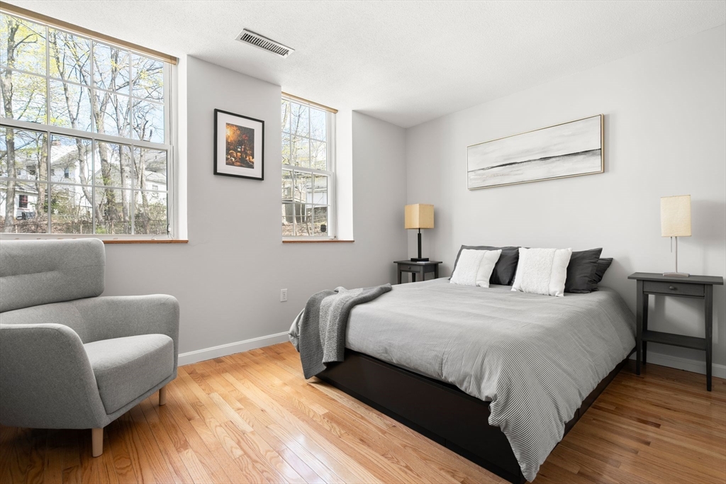 35 Eldridge Road, Unit 202 Boston, MA 02130 - Photo 12 of 31 a bedroom with a bed couch and window