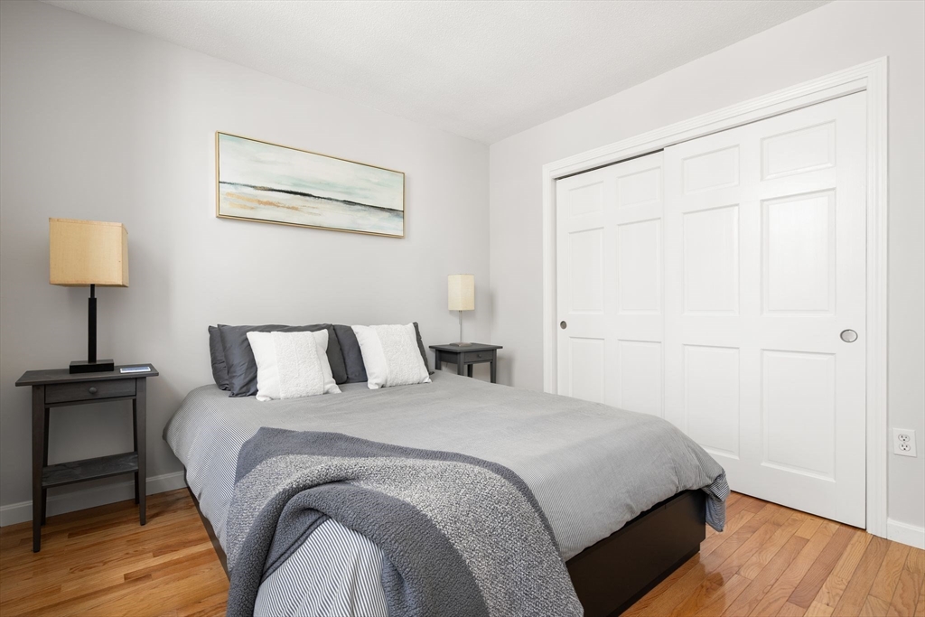 35 Eldridge Road, Unit 202 Boston, MA 02130 - Photo 13 of 31 a bedroom with a bed and a lamp