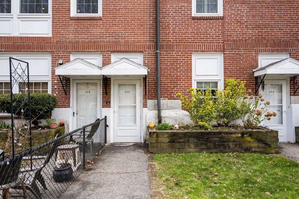 35 Eldridge Road, Unit 202 Boston, MA 02130 - Photo 22 of 31 a front view of a house with a yard