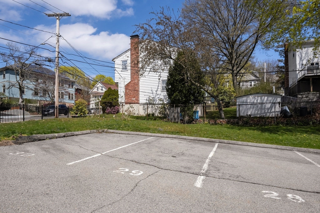 35 Eldridge Road, Unit 202 Boston, MA 02130 - Photo 24 of 31 a tall building with trees in front of it