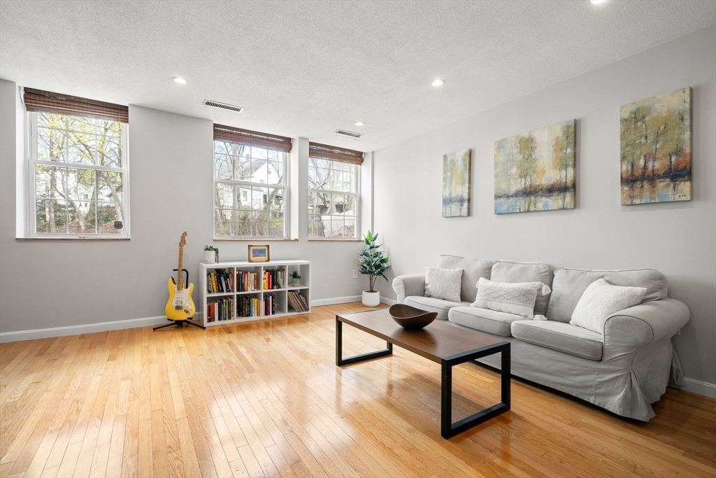 35 Eldridge Road, Unit 202 Boston, MA 02130 - Photo 3 of 31 a living room with furniture and a wooden floor