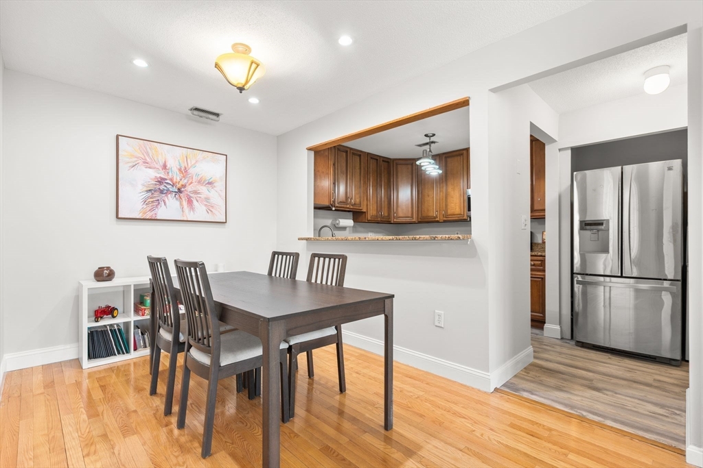 35 Eldridge Road, Unit 202 Boston, MA 02130 - Photo 8 of 31 a view of a dining room with furniture and wooden floor