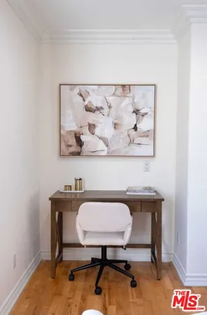 a bedroom with bed and a night stand