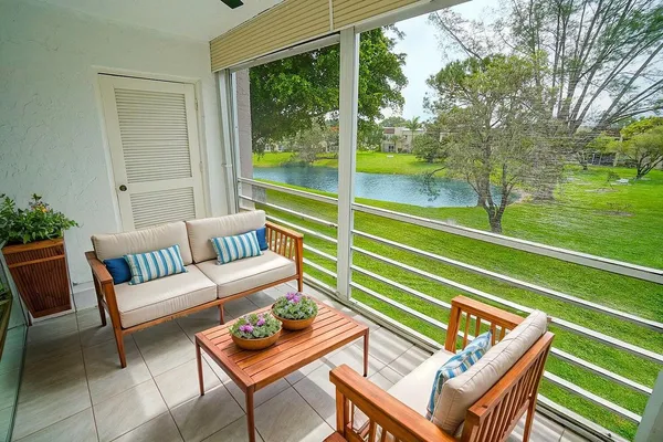 a view of a two chairs in the patio