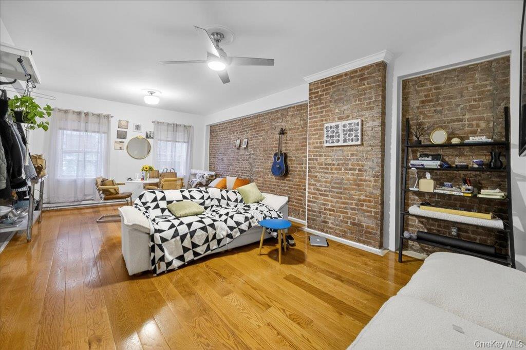 89 Liberty Street Newburgh, NY 12550 - Photo 12 of 33 a bed room with a bed and a television