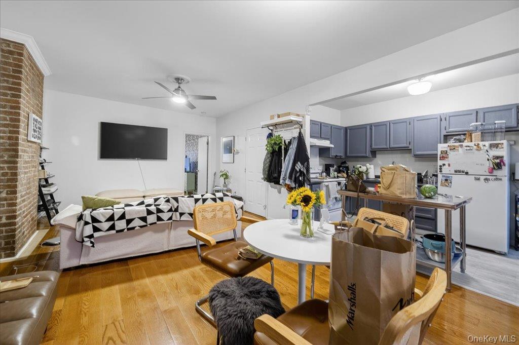 89 Liberty Street Newburgh, NY 12550 - Photo 14 of 33 a living room with furniture and a flat screen tv