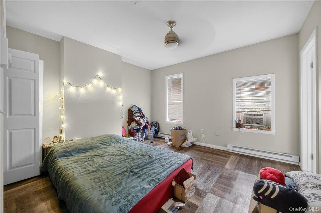 89 Liberty Street Newburgh, NY 12550 - Photo 24 of 33 a bed room with a bed window and a couch