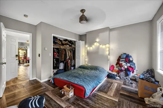 a bed room with a bed and a chandelier