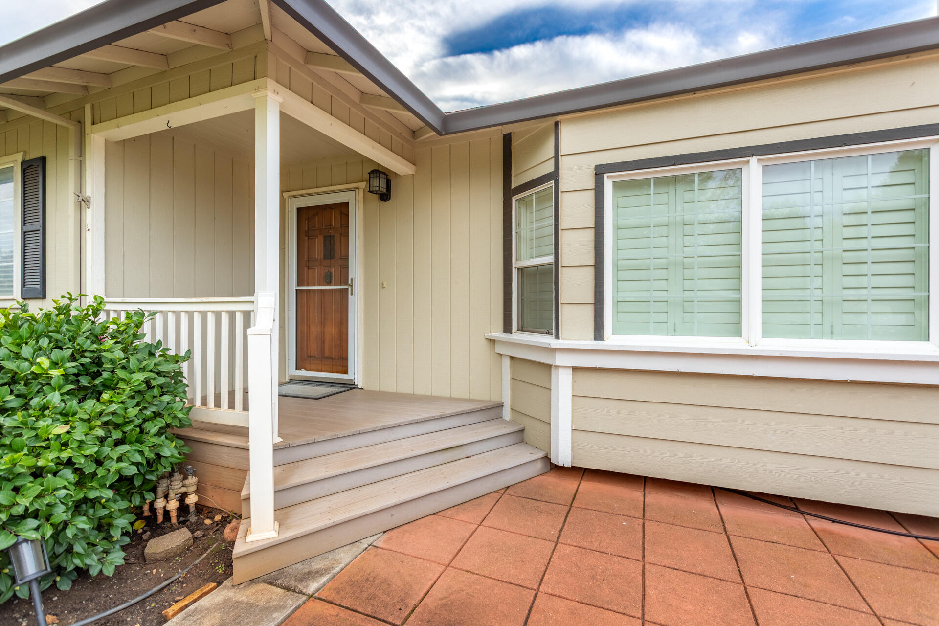 6766 Drake Drive Anderson, CA 96007 - Photo 11 of 44 a view of white house with a large window and wooden floor