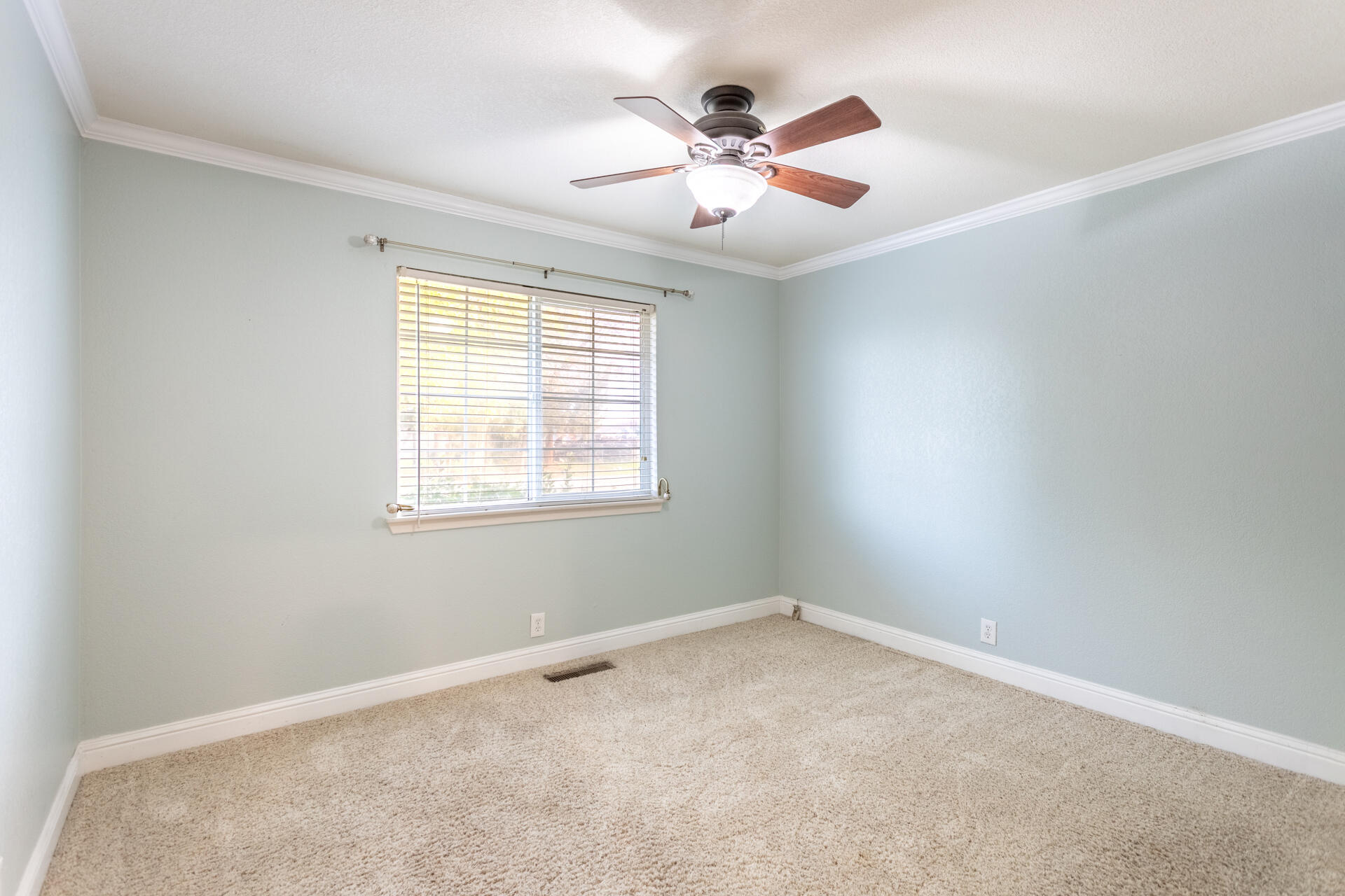 6766 Drake Drive Anderson, CA 96007 - Photo 26 of 44 an empty room with a window and a fan