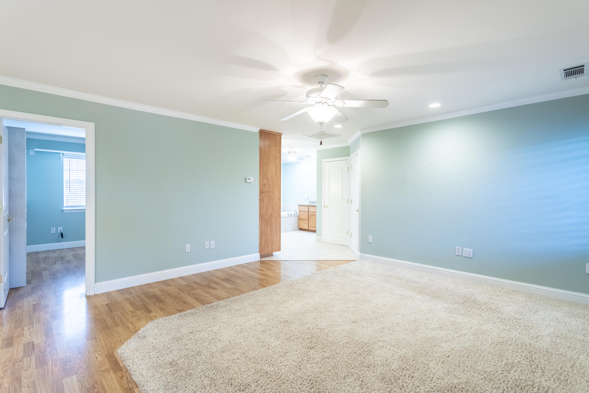 6766 Drake Drive Anderson, CA 96007 - Photo 28 of 44 a view of an empty room with chandelier fan and wooden floor