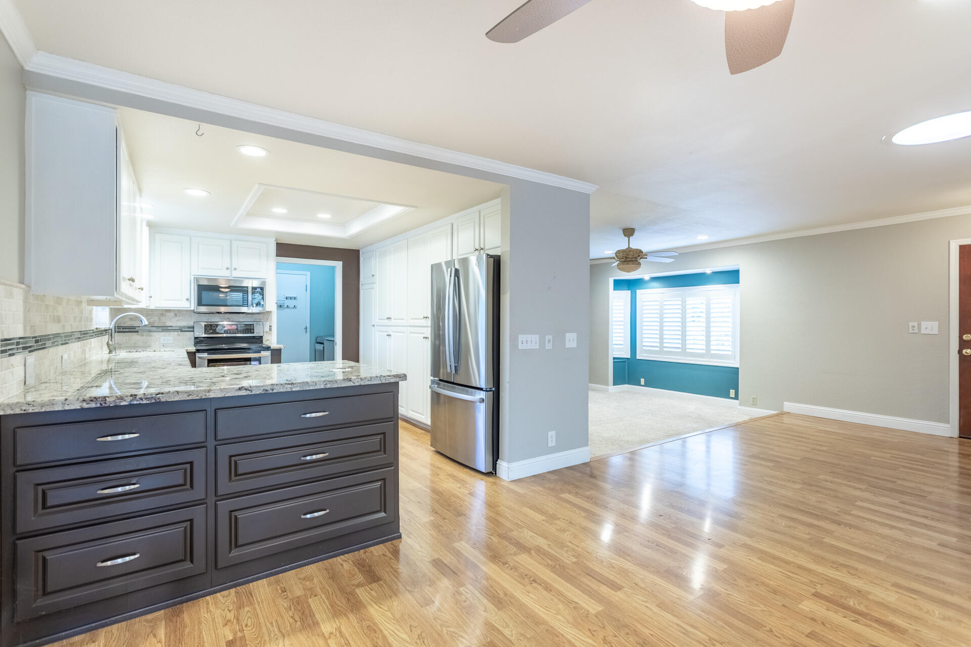 6766 Drake Drive Anderson, CA 96007 - Photo 34 of 44 a kitchen with granite countertop wooden cabinets and stainless steel appliances
