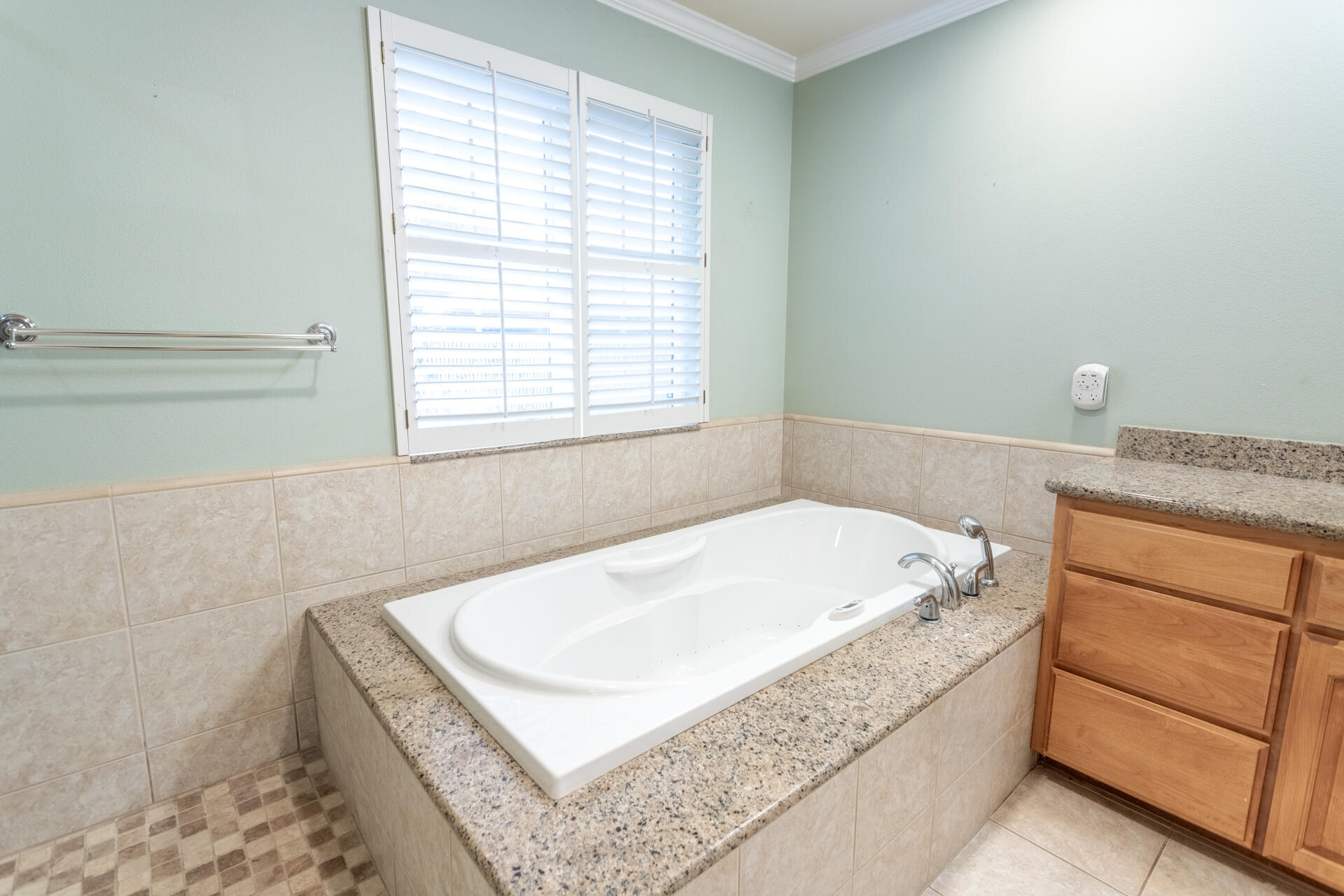 6766 Drake Drive Anderson, CA 96007 - Photo 44 of 44 a bathroom with a tub a sink and a window