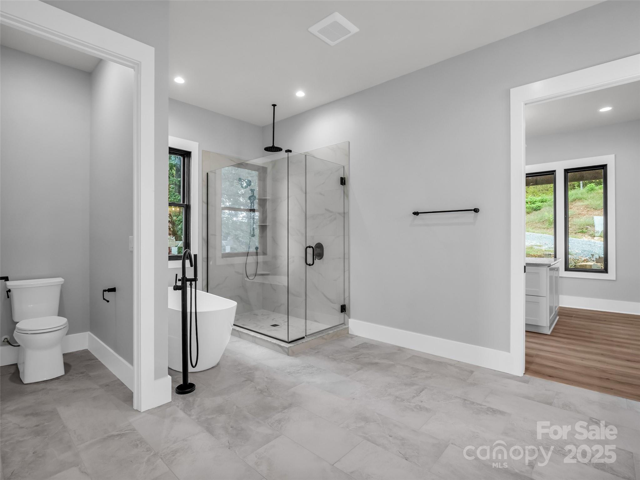 93 Chesterfield Drive Mill Spring, NC 28756 - Photo 19 of 48 a spacious bathroom with a shower and a toilet