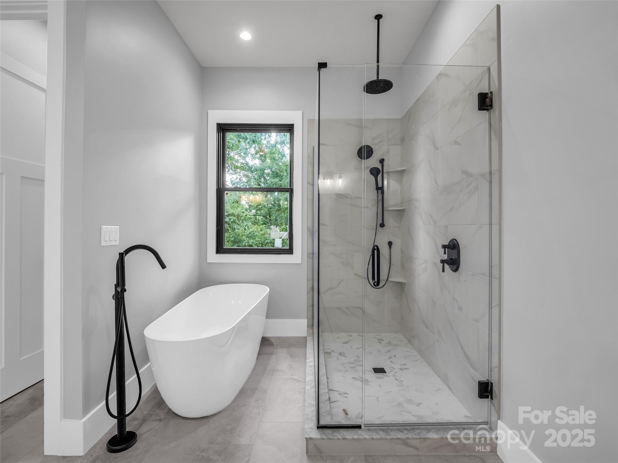 93 Chesterfield Drive Mill Spring, NC 28756 - Photo 20 of 48 a bathroom with a tub a sink and shower