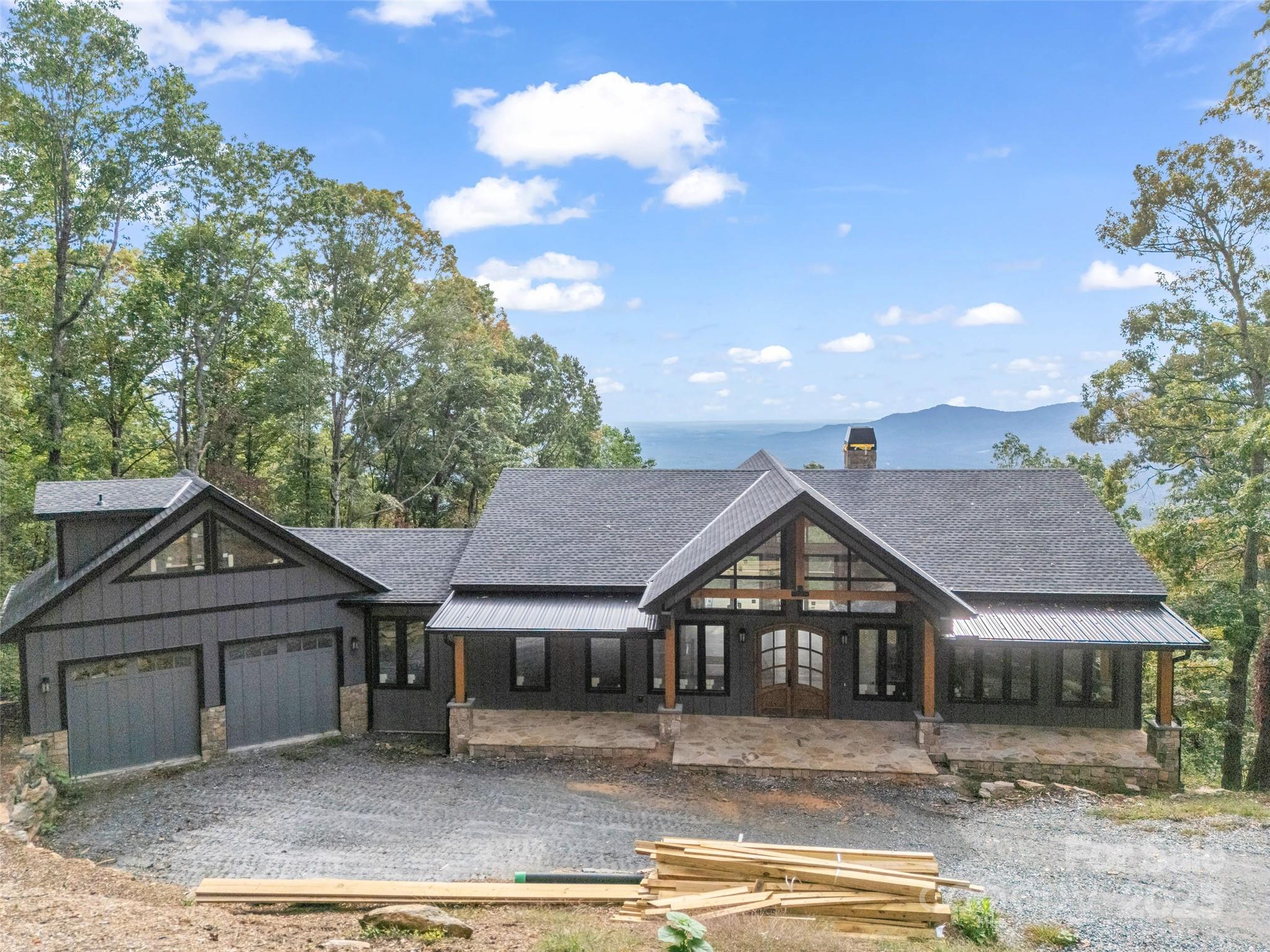 93 Chesterfield Drive Mill Spring, NC 28756 - Photo 2 of 48 front view of a house with a yard