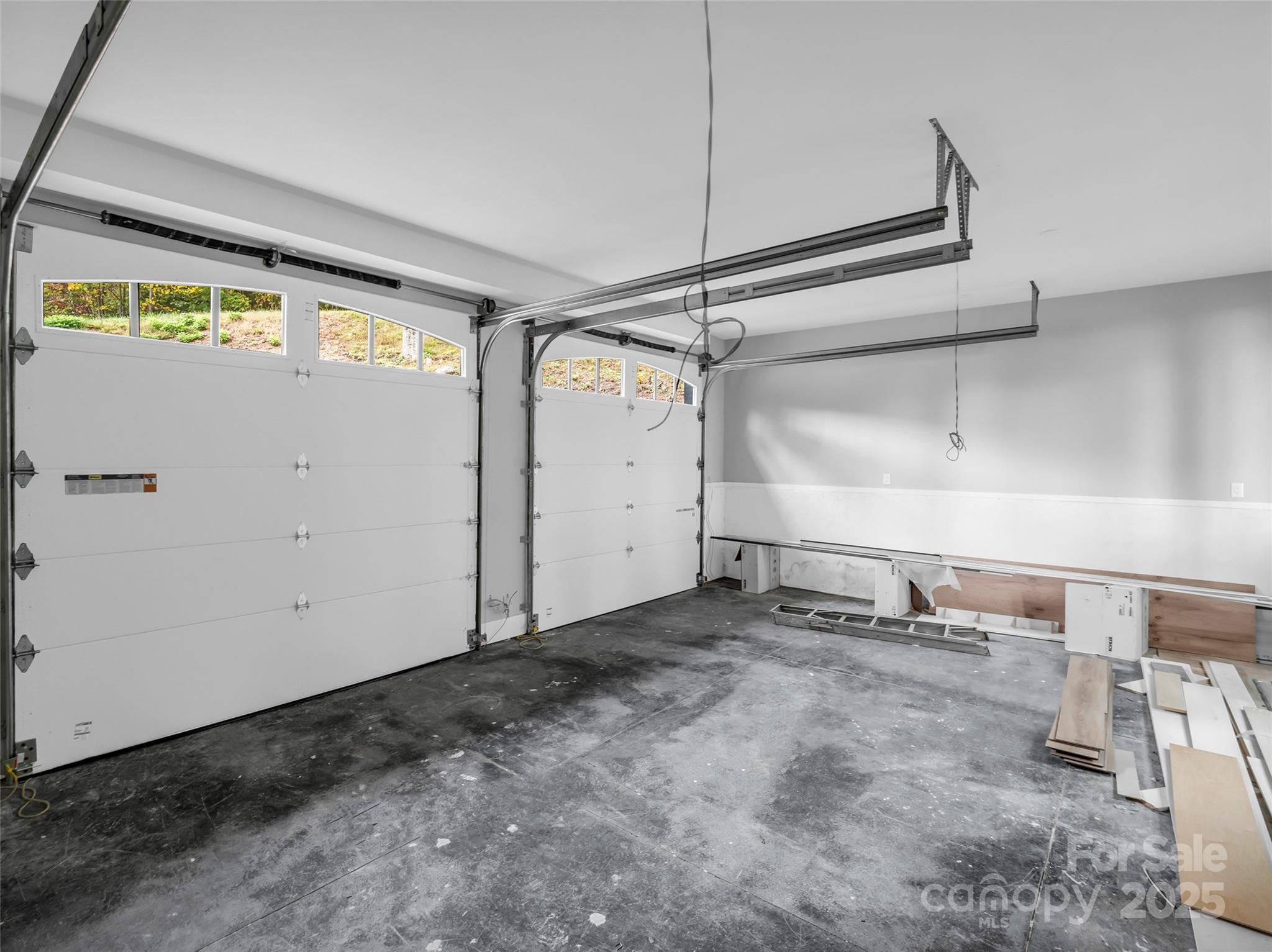 93 Chesterfield Drive Mill Spring, NC 28756 - Photo 33 of 48 a view of a garage with storage