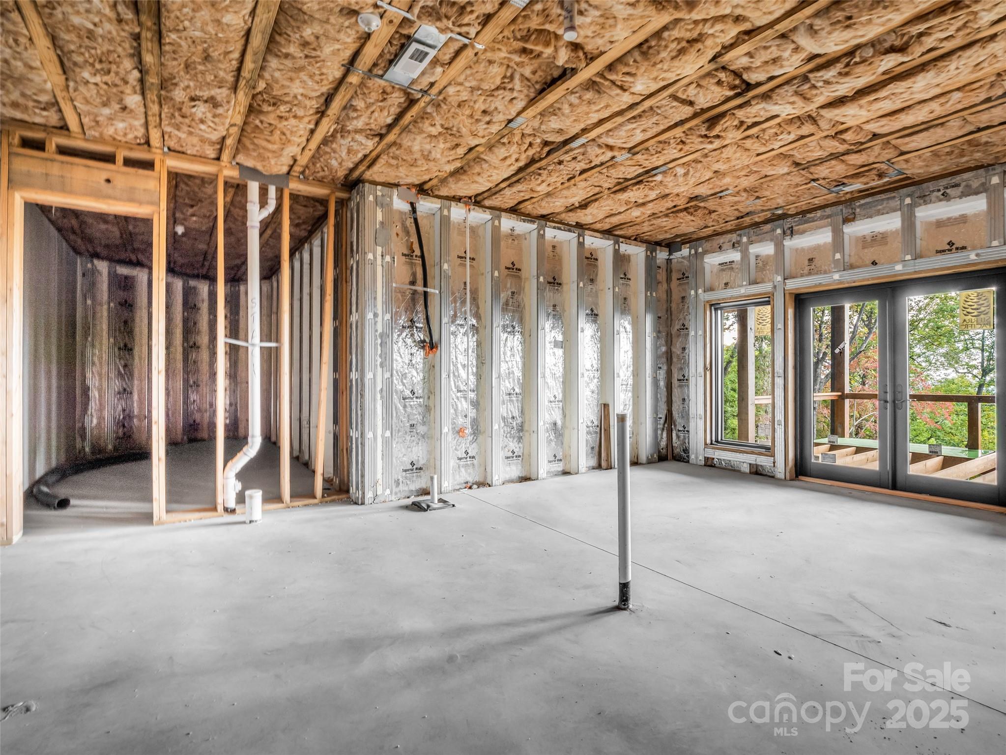93 Chesterfield Drive Mill Spring, NC 28756 - Photo 35 of 48 a view of an empty room with a sliding door