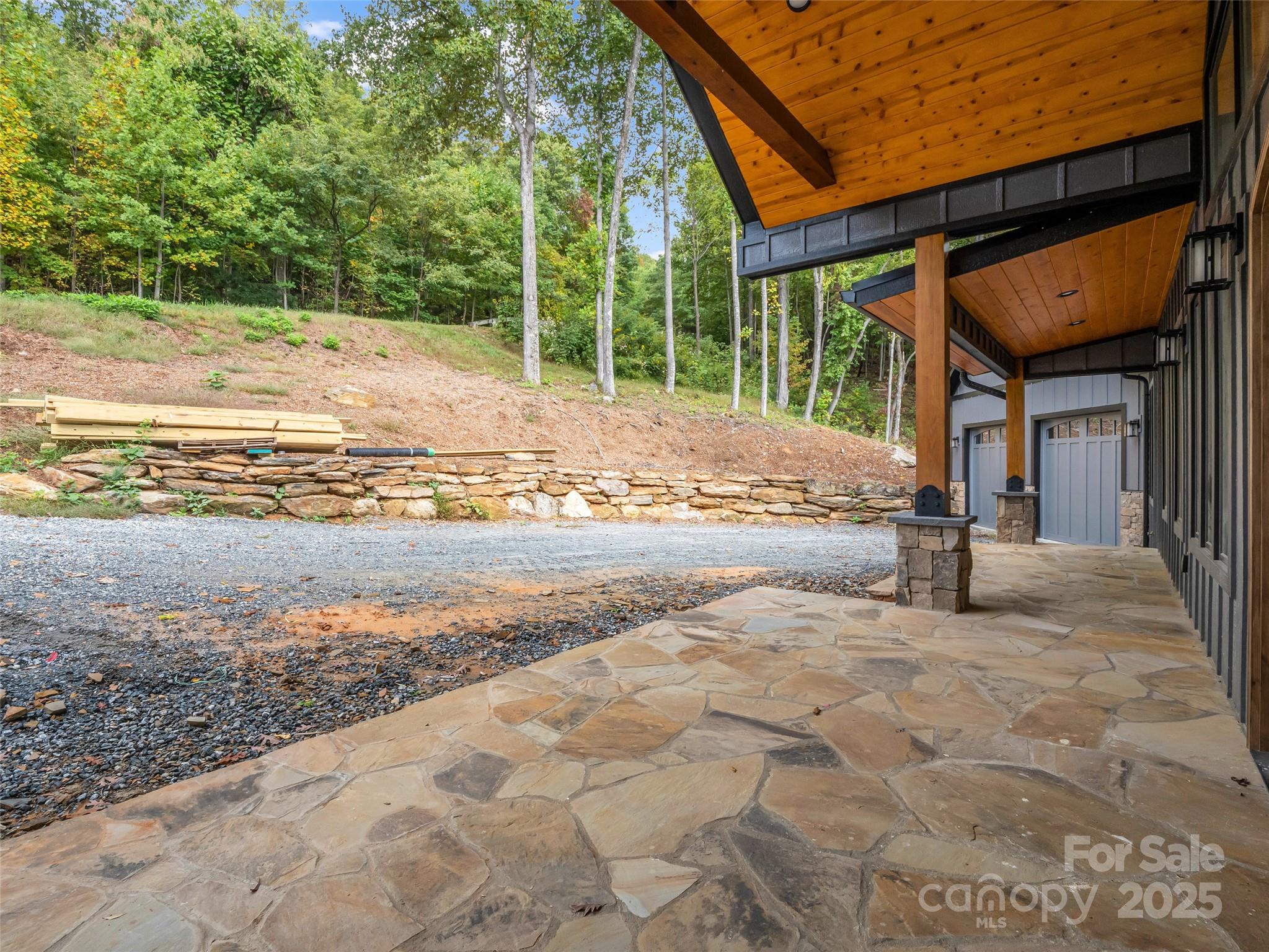 93 Chesterfield Drive Mill Spring, NC 28756 - Photo 38 of 48 a view of a house with backyard and a trees