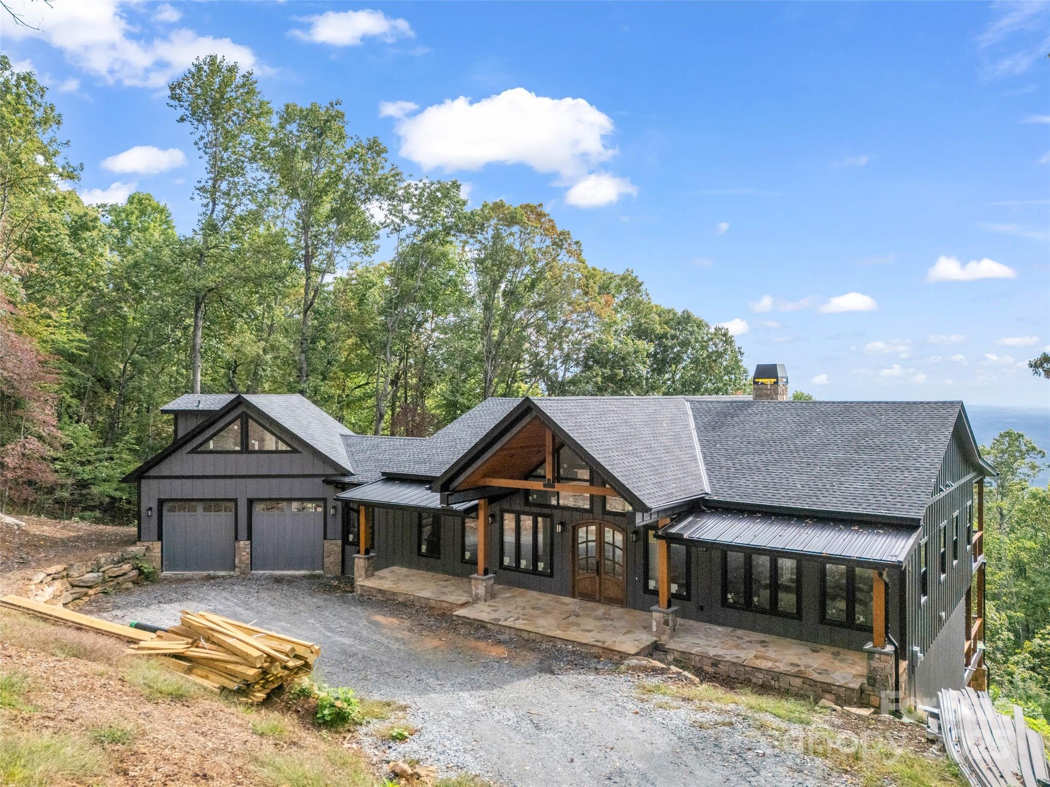 93 Chesterfield Drive Mill Spring, NC 28756 - Photo 40 of 48 front view of a house with a yard