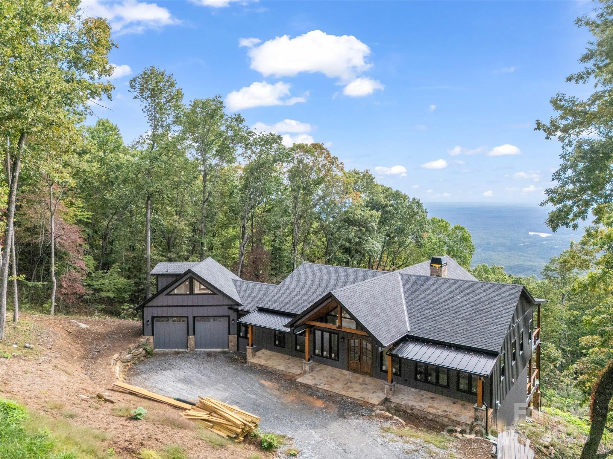 93 Chesterfield Drive Mill Spring, NC 28756 - Photo 41 of 48 an aerial view of a house with garden space and street view