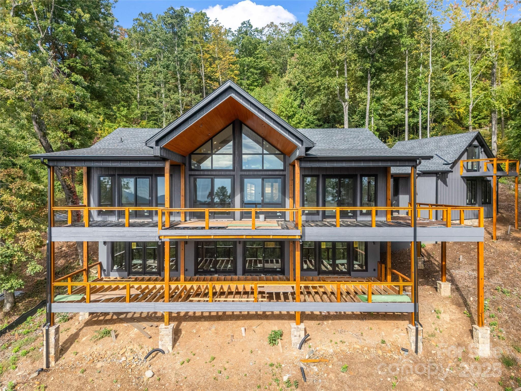 93 Chesterfield Drive Mill Spring, NC 28756 - Photo 43 of 48 a house with large trees in the background