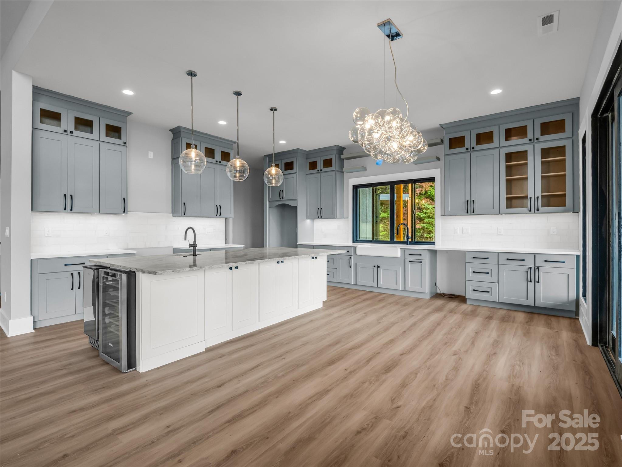 93 Chesterfield Drive Mill Spring, NC 28756 - Photo 9 of 48 a large kitchen with granite countertop a large counter top and sink