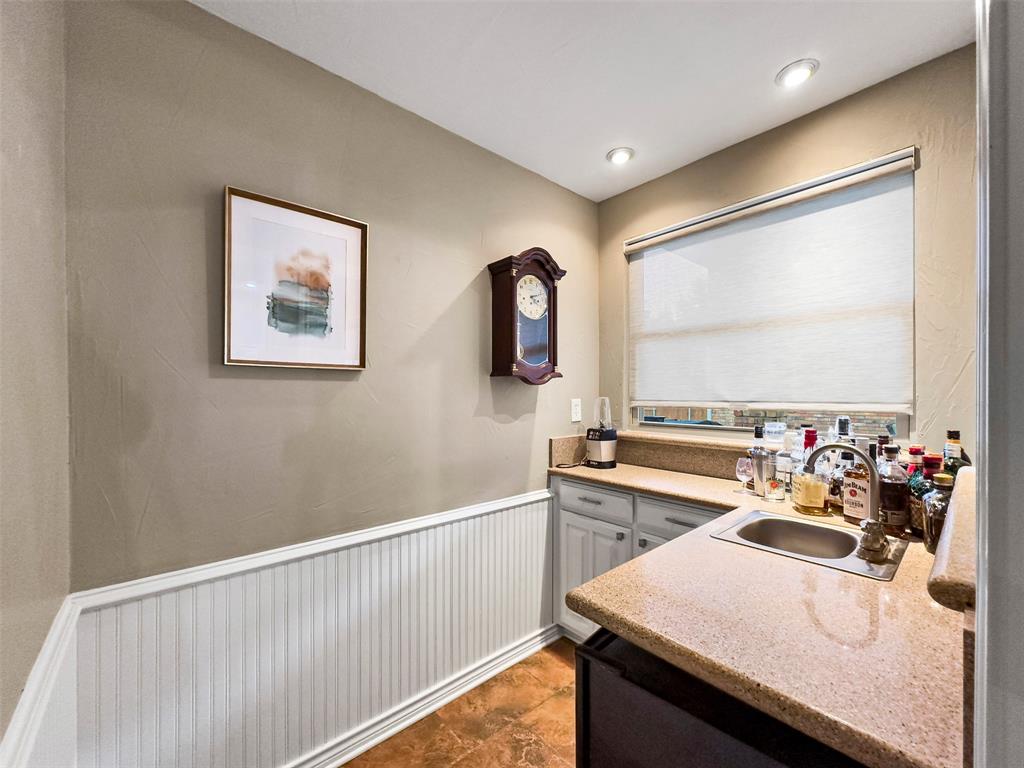 6306 Chelsea Way Garland, TX 75044 - Photo 15 of 37 Bar Area with Sink connected to Family room