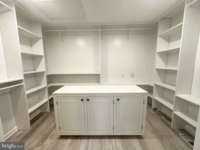 a utility room with cabinets washer and dryer