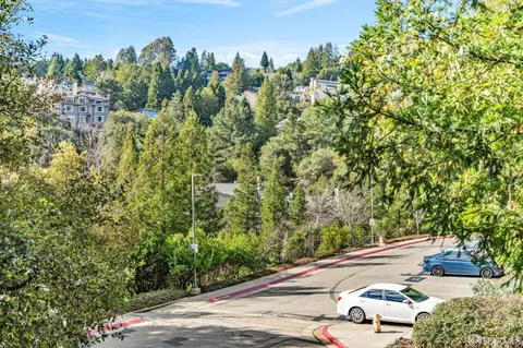 a view of a yard and street from a building