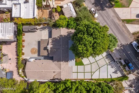 an aerial view of multiple houses with yard