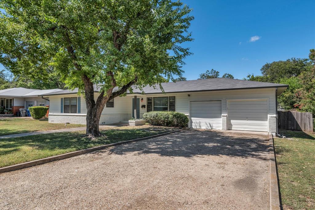 1325 Sunset Street Waco, TX 76710 - Photo 2 of 40 Ranch-style house with driveway, an attached garage, and brick siding