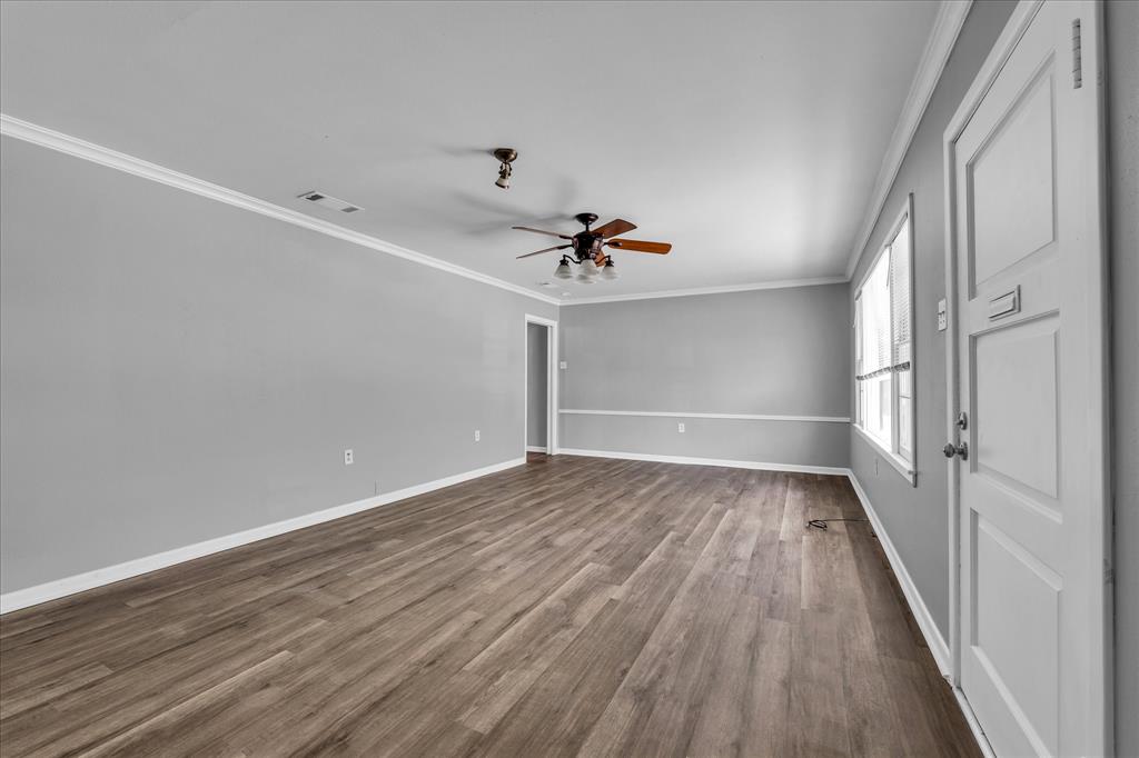 1325 Sunset Street Waco, TX 76710 - Photo 9 of 40 Unfurnished bedroom featuring crown molding, dark wood-style flooring, and ceiling fan
