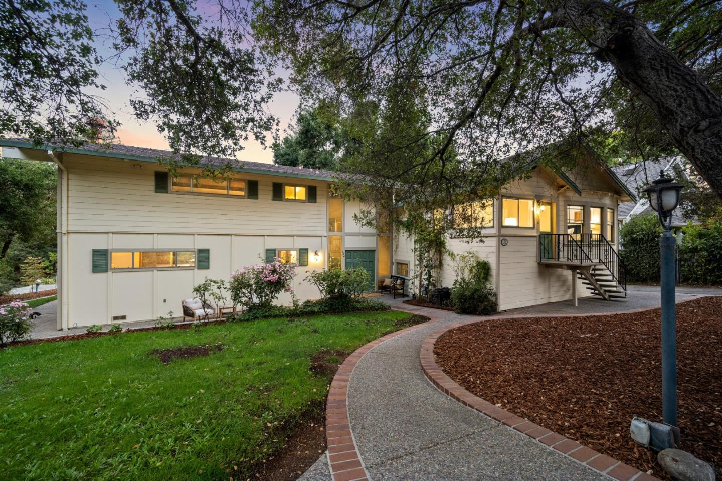132 Alta Vista Road Woodside, CA 94062 - Photo 1 of 44 a front view of a house with a yard and trees