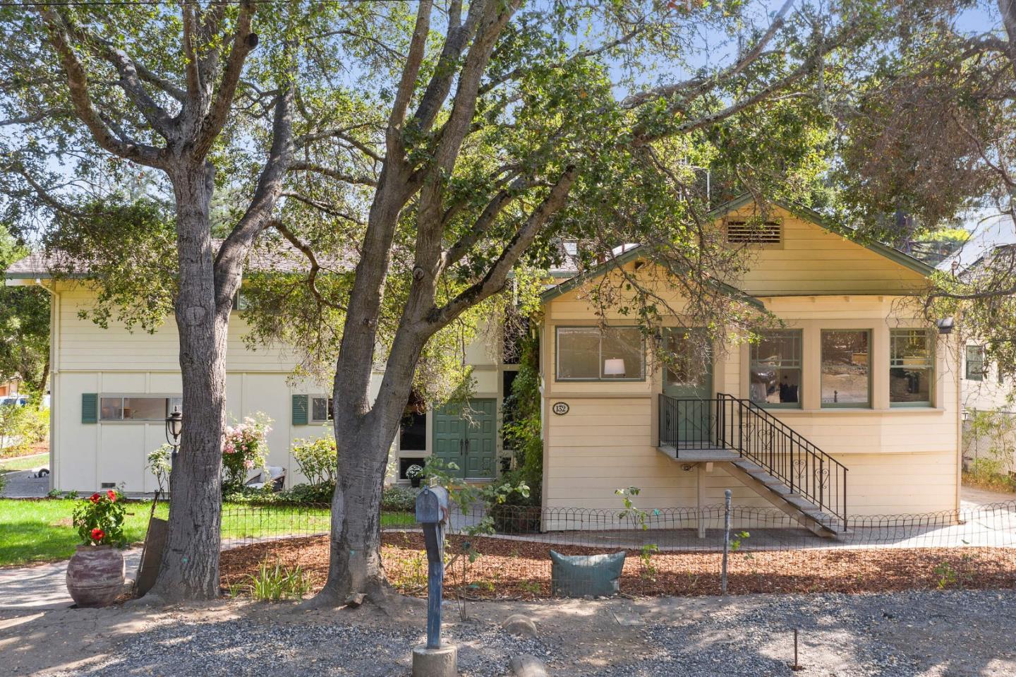 132 Alta Vista Road Woodside, CA 94062 - Photo 2 of 44 a view of a house with large tree and a yard